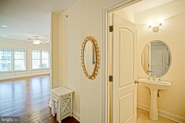 a bathroom with a sink mirror and toilet