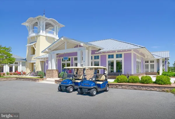 a view of a lake with a house in the background