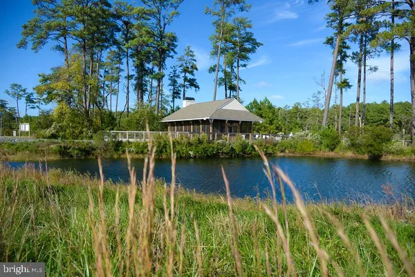 an aerial view of a house with a lake view