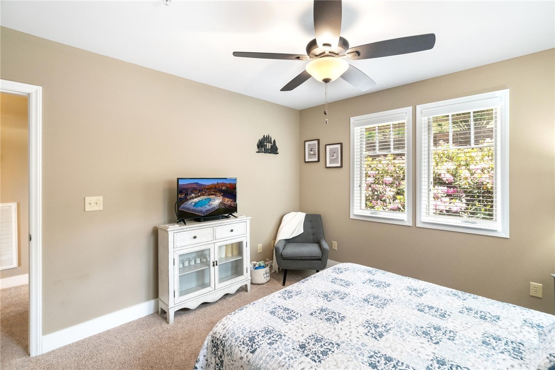 942 Ridge Haven Parkway, Unit R1211 Banner Elk, NC 28604 - Photo 27 of 45 a bedroom with a bed and a window