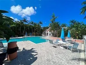 a view of a backyard with sitting area