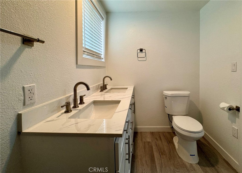 1362 South Downey Road Los Angeles, CA 90023 - Photo 23 of 30 a bathroom with a sink and a toilet