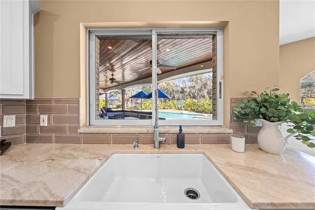 a spacious bathroom with a tub sink and mirror