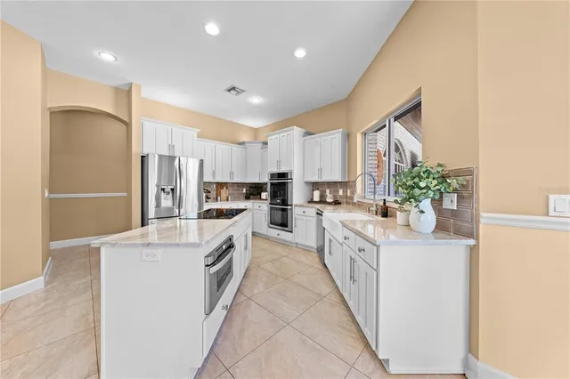 a bedroom with a bed and a wooden floor