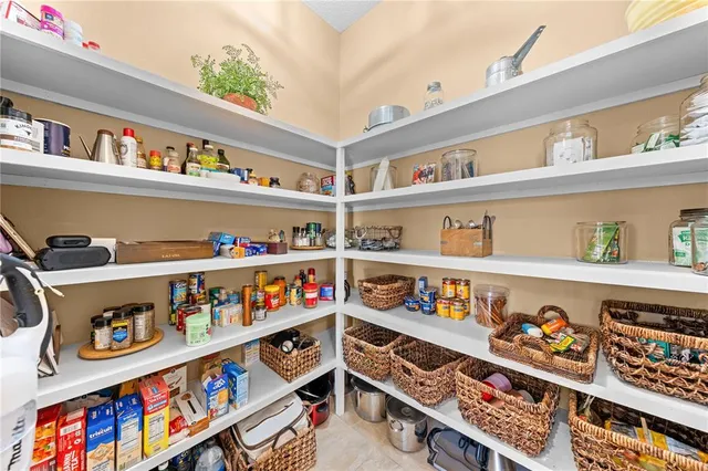 a bathroom with a granite countertop sink a toilet a mirror and shower