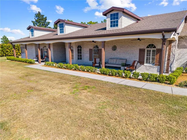 a view of a patio with table and chairs potted plants with wooden fence