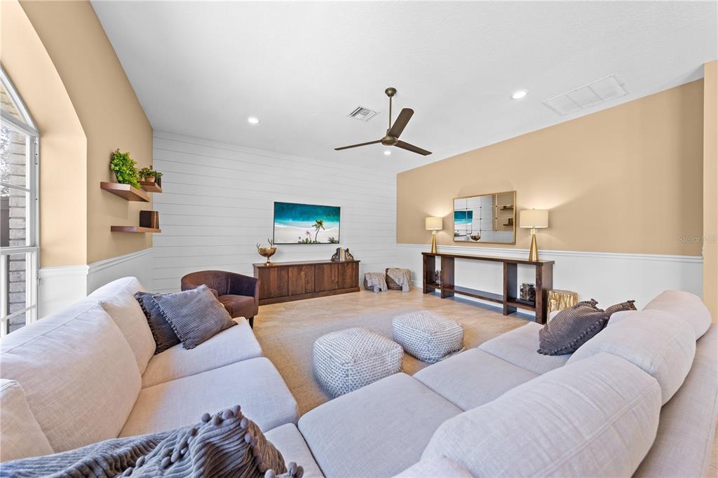 4231 Albritton Road St. Cloud, FL 34772 - Photo 32 of 94 a living room with furniture and a wooden floor