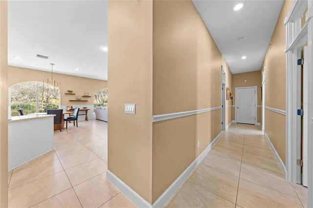 a view of a patio with a table and chairs under an umbrella