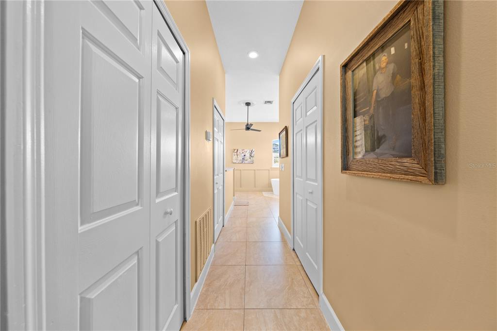 4231 Albritton Road St. Cloud, FL 34772 - Photo 45 of 94 a view of a hallway with wooden floor and staircase