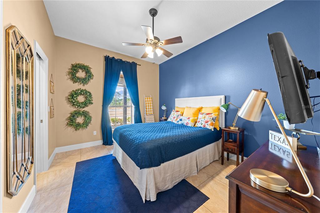 4231 Albritton Road St. Cloud, FL 34772 - Photo 48 of 94 a bedroom with a bed and a wooden floor