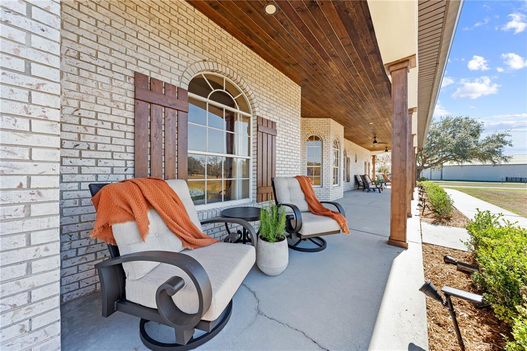 4231 Albritton Road St. Cloud, FL 34772 - Photo 5 of 94 a view of a patio with table and chairs potted plants with wooden fence