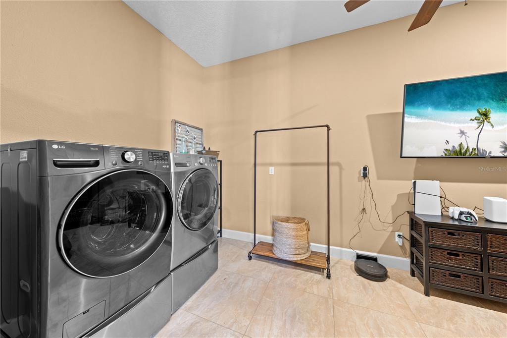 4231 Albritton Road St. Cloud, FL 34772 - Photo 53 of 94 a view of a bedroom with washer and dryer