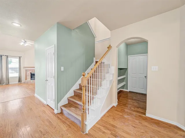 a view of a hallway with staircase