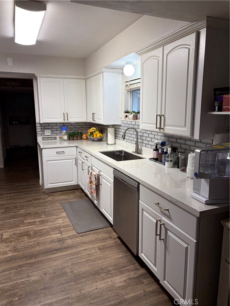 646 El Rancho Drive El Cajon, CA 92019 - Photo 11 of 23 a kitchen with a sink stove and cabinets