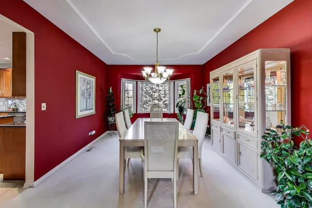 a view of a dining room with furniture window and chandelier