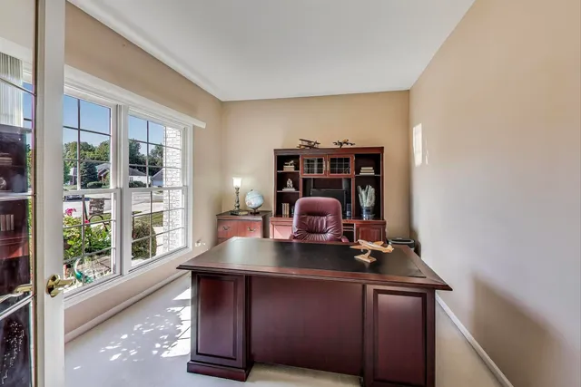 a dining room with furniture and window
