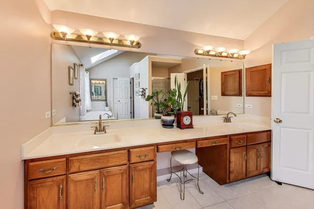 a bathroom with a sink double vanity and a mirror