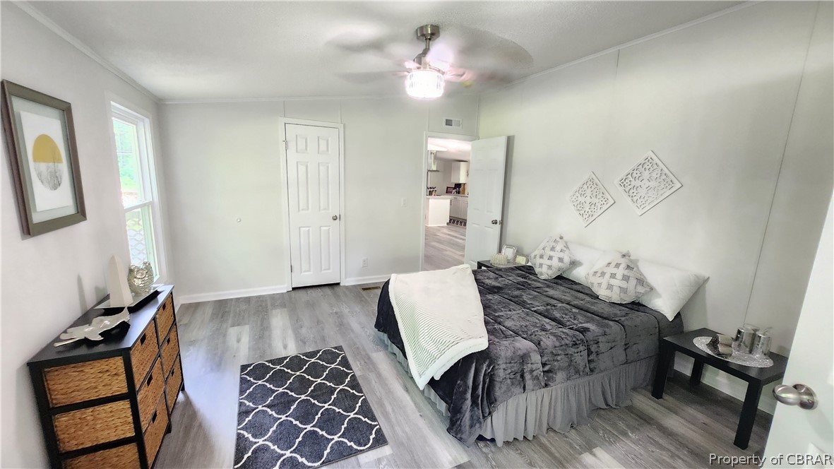 8065 Filly Run Road Gloucester, VA 23061 - Photo 12 of 33 Bedroom with ceiling fan and hardwood / wood-style floors