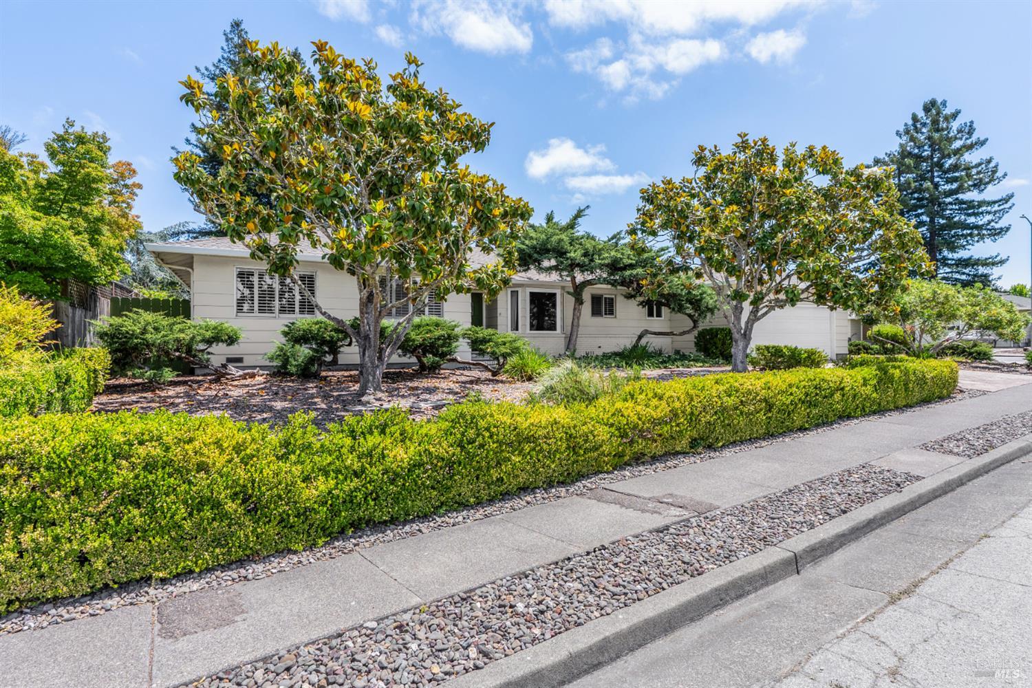 2904 Jason Drive Santa Rosa, CA 95405 - Photo 2 of 33 a front view of a house with a garden and tree