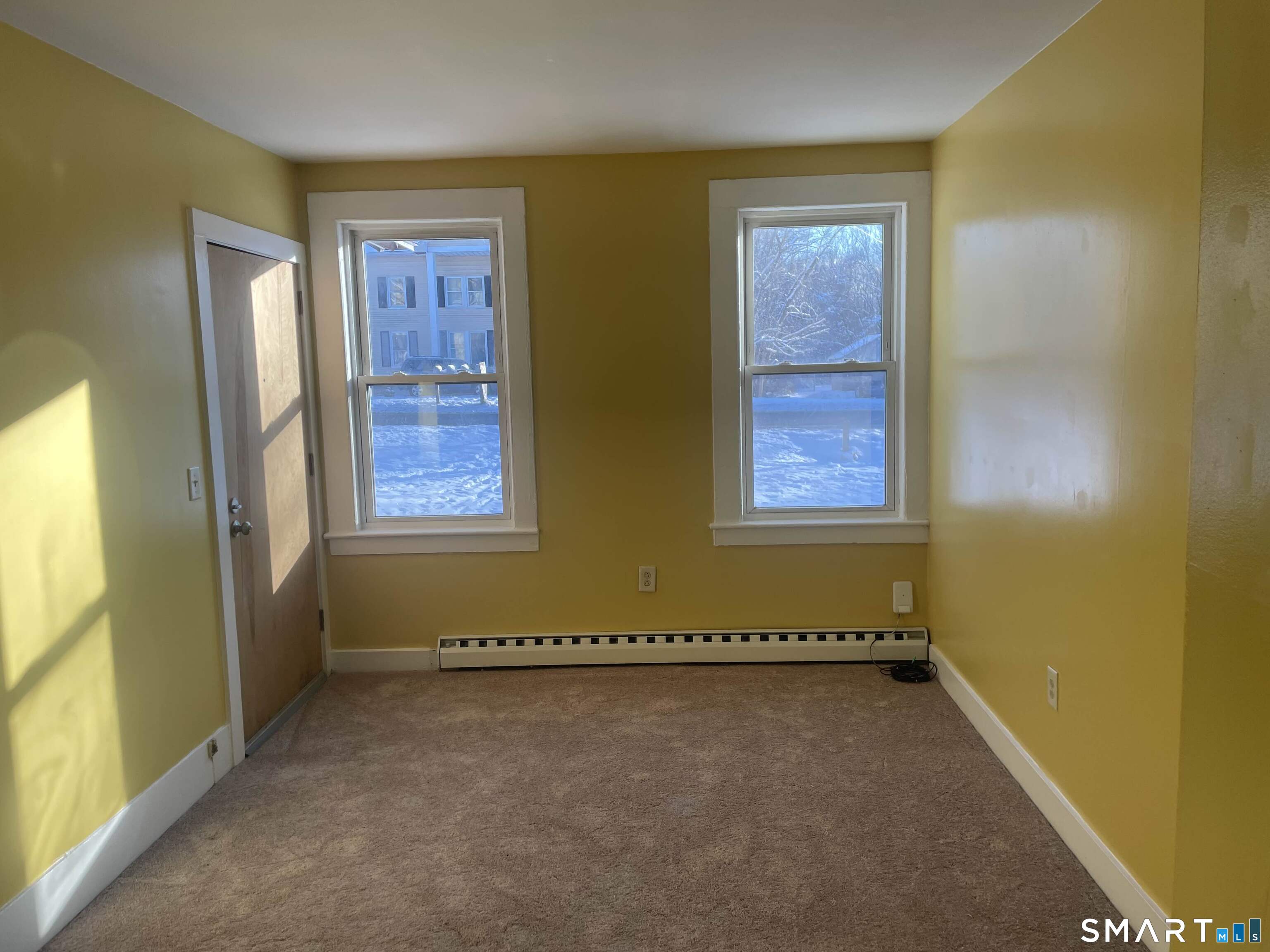 57 North Main Street, Unit D Windsor Locks, CT 06096 - Photo 2 of 7 a view of a room with two windows