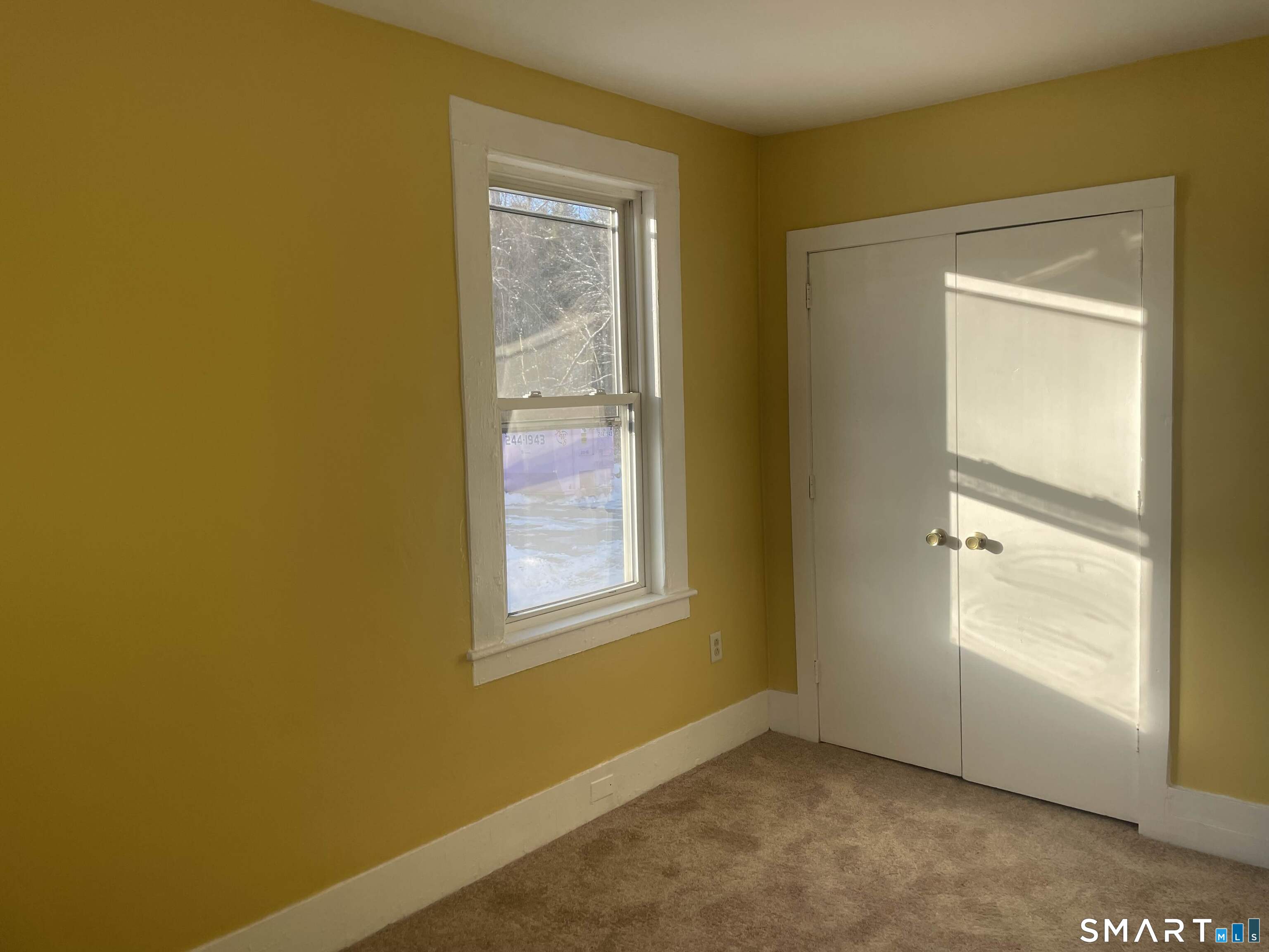 57 North Main Street, Unit D Windsor Locks, CT 06096 - Photo 4 of 7 an empty room with windows