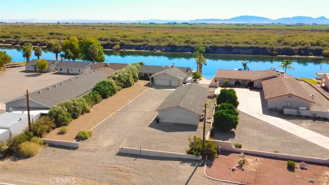 an aerial view of a house with a ocean view