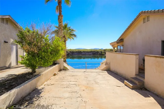 a bedroom with a large bed and a large window