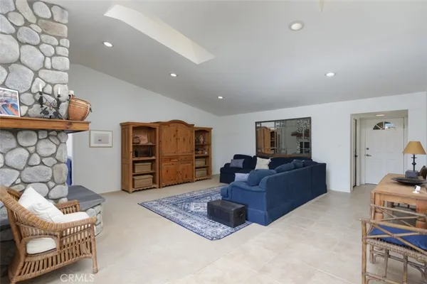 a kitchen with granite countertop a refrigerator and a sink