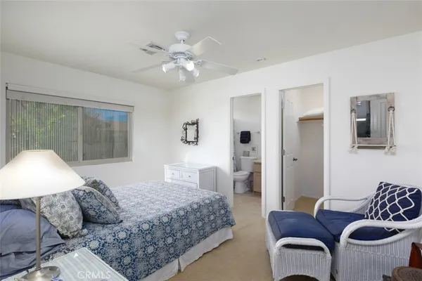 a bedroom with a large bed and a large window