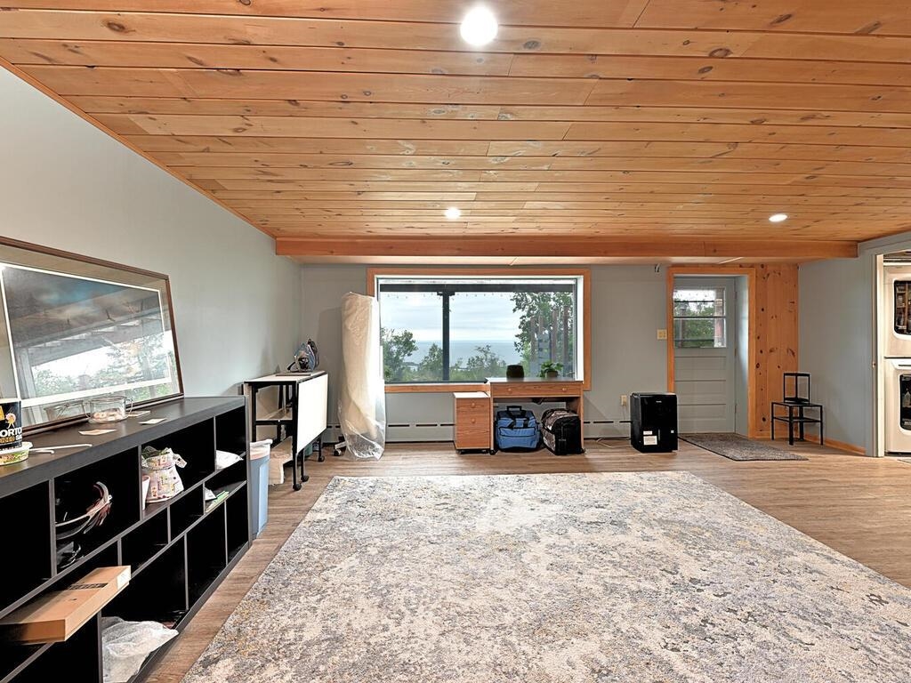 7 Kent Lane Silver Bay, MN 55614 - Photo 24 of 32 Living area featuring wood ceiling, light wood-style floors, a baseboard heating unit, and recessed lighting