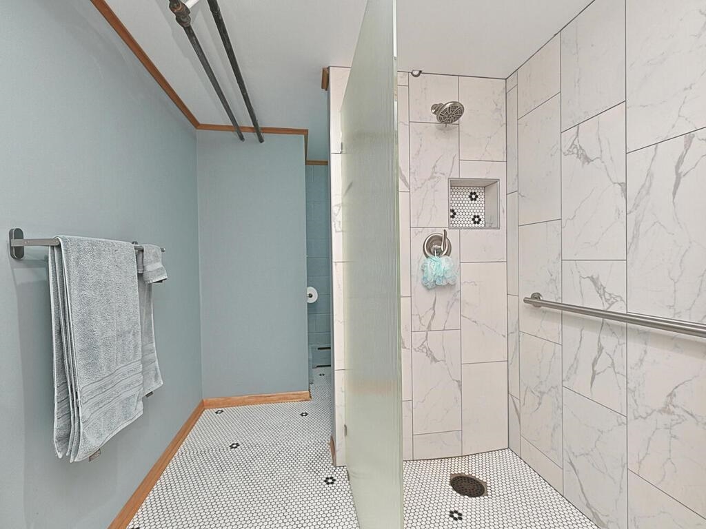 7 Kent Lane Silver Bay, MN 55614 - Photo 26 of 32 Bathroom with a shower stall and tile patterned flooring