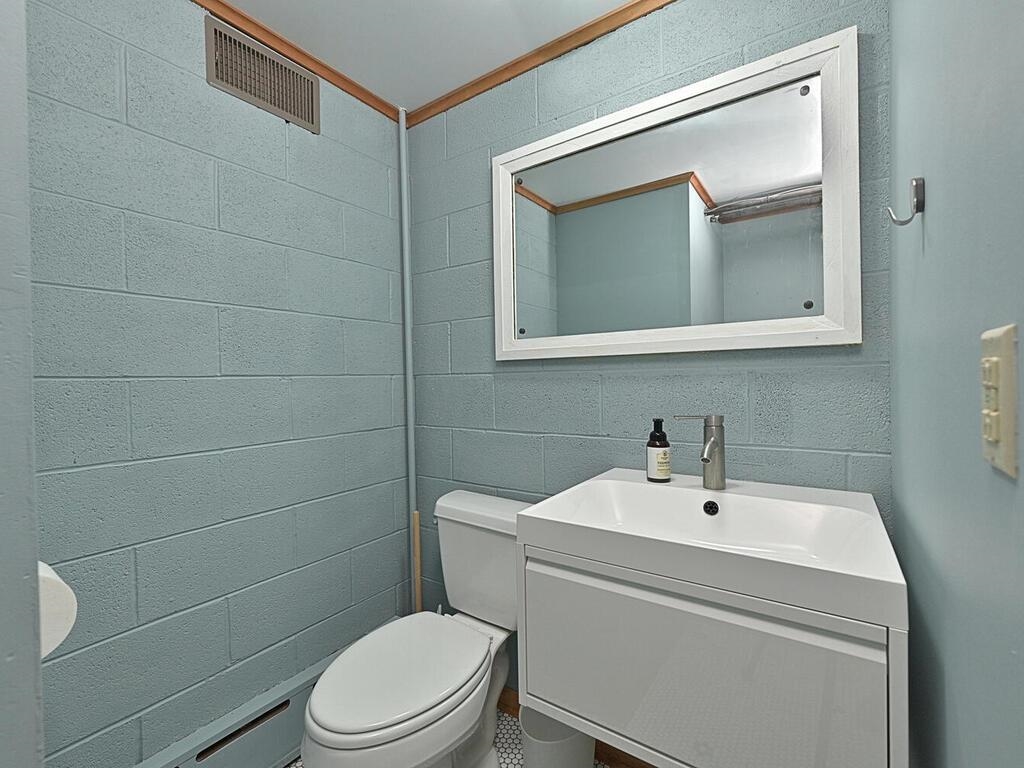 7 Kent Lane Silver Bay, MN 55614 - Photo 27 of 32 Bathroom featuring vanity and toilet