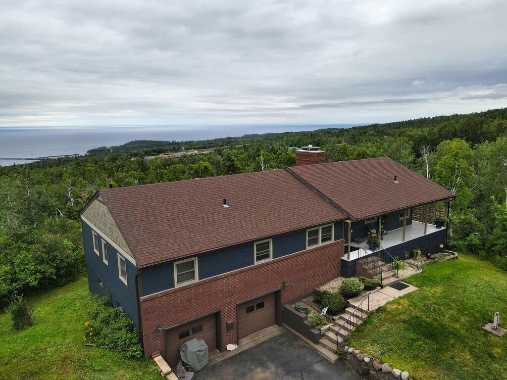 7 Kent Lane Silver Bay, MN 55614 - Photo 28 of 32 Bird's eye view of a forest and a nearby body of water