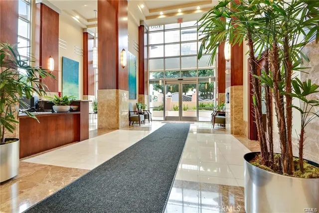a living room with furniture and flowers