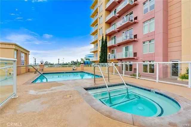 a view of a swimming pool with outdoor seating