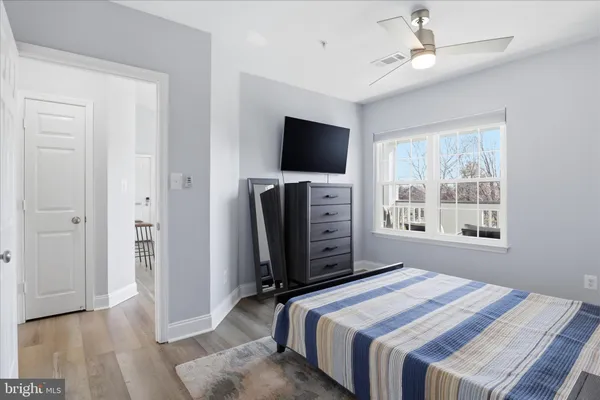 a bedroom with a bed and a television