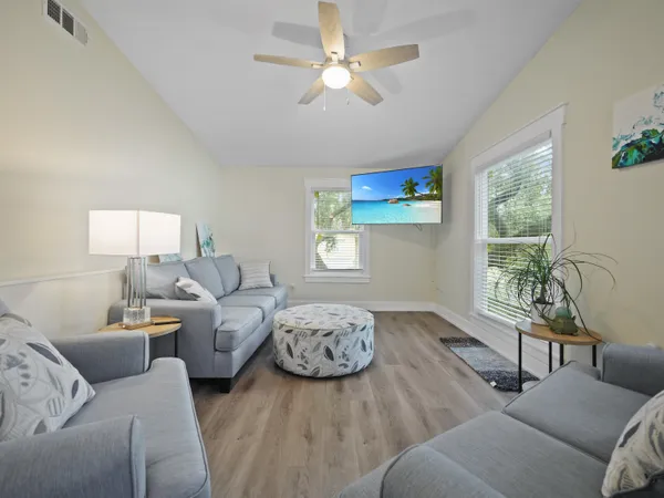 a living room with furniture and a window