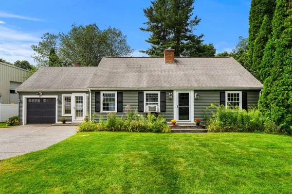 a view of a house with garden and yard