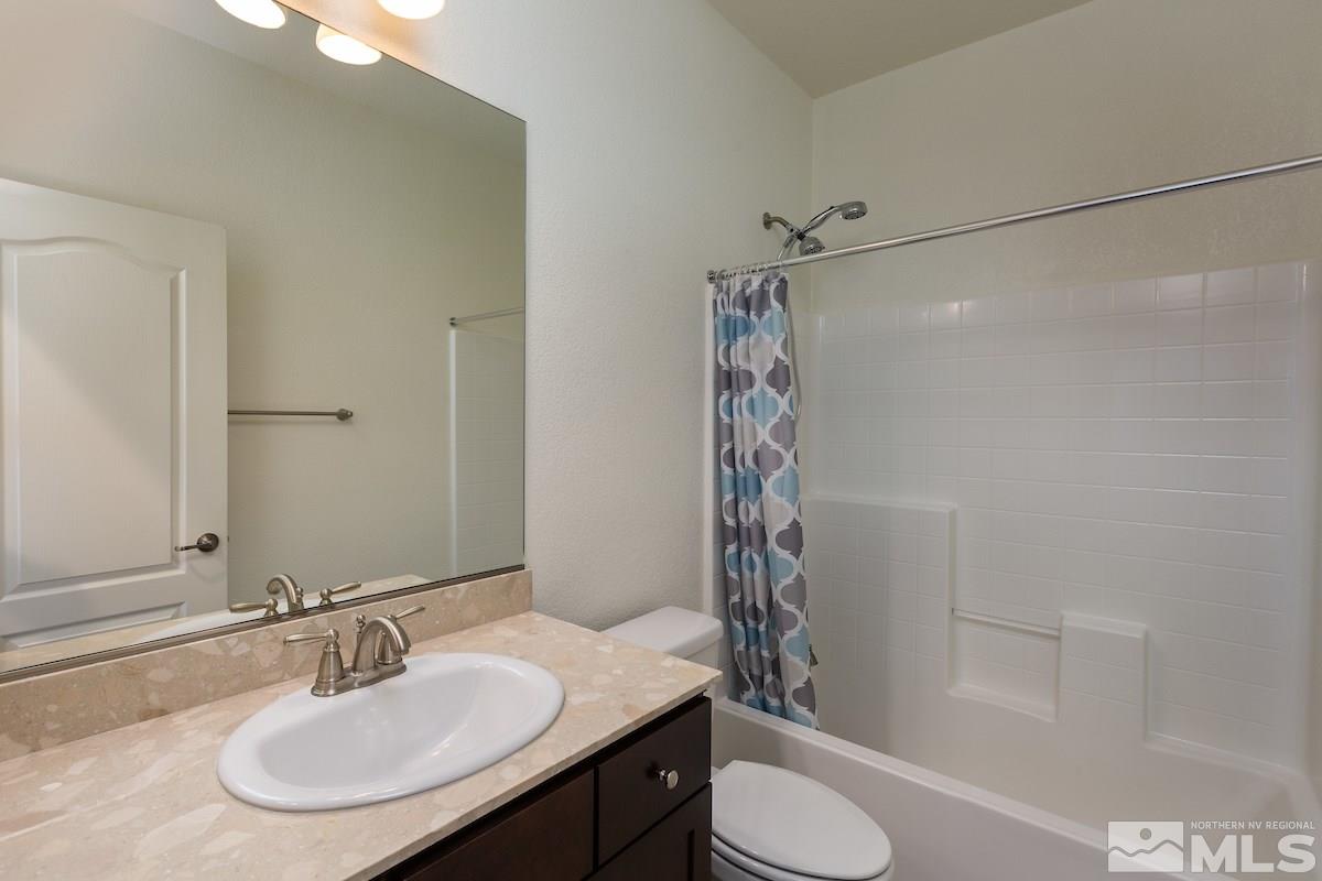 10800 Walnut Ridge Drive Reno, NV 89521 - Photo 23 of 25 a bathroom with a sink toilet and shower