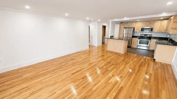 a view of kitchen with wooden floor