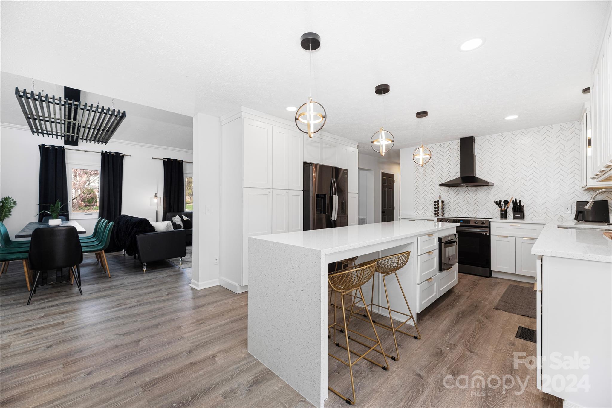 262 Spring Run Road Mooresville, NC 28117 - Photo 11 of 48 a kitchen with kitchen island a counter top space appliances and a ceiling fan