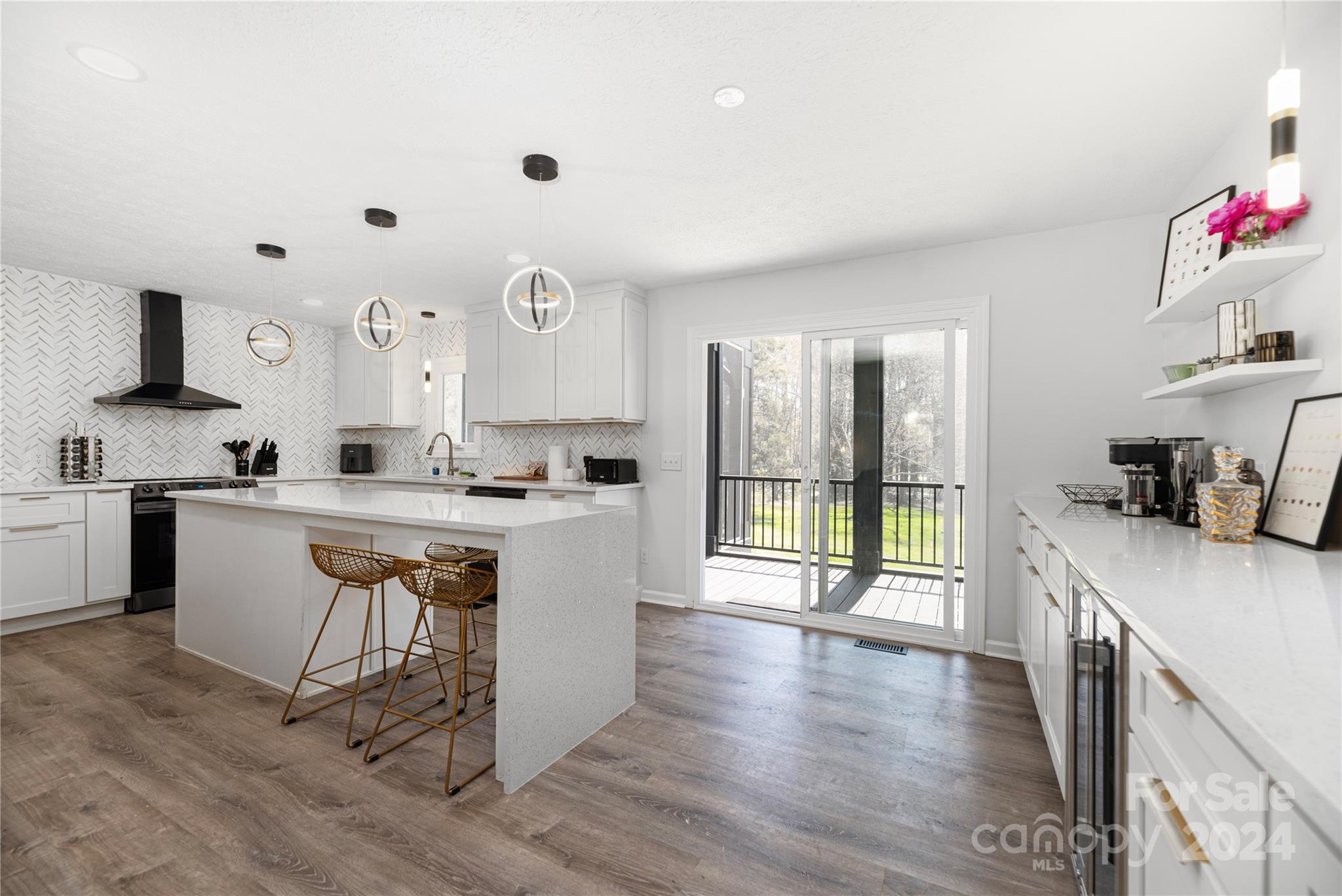 262 Spring Run Road Mooresville, NC 28117 - Photo 12 of 48 a kitchen with granite countertop a stove a sink dishwasher and a refrigerator with wooden floor