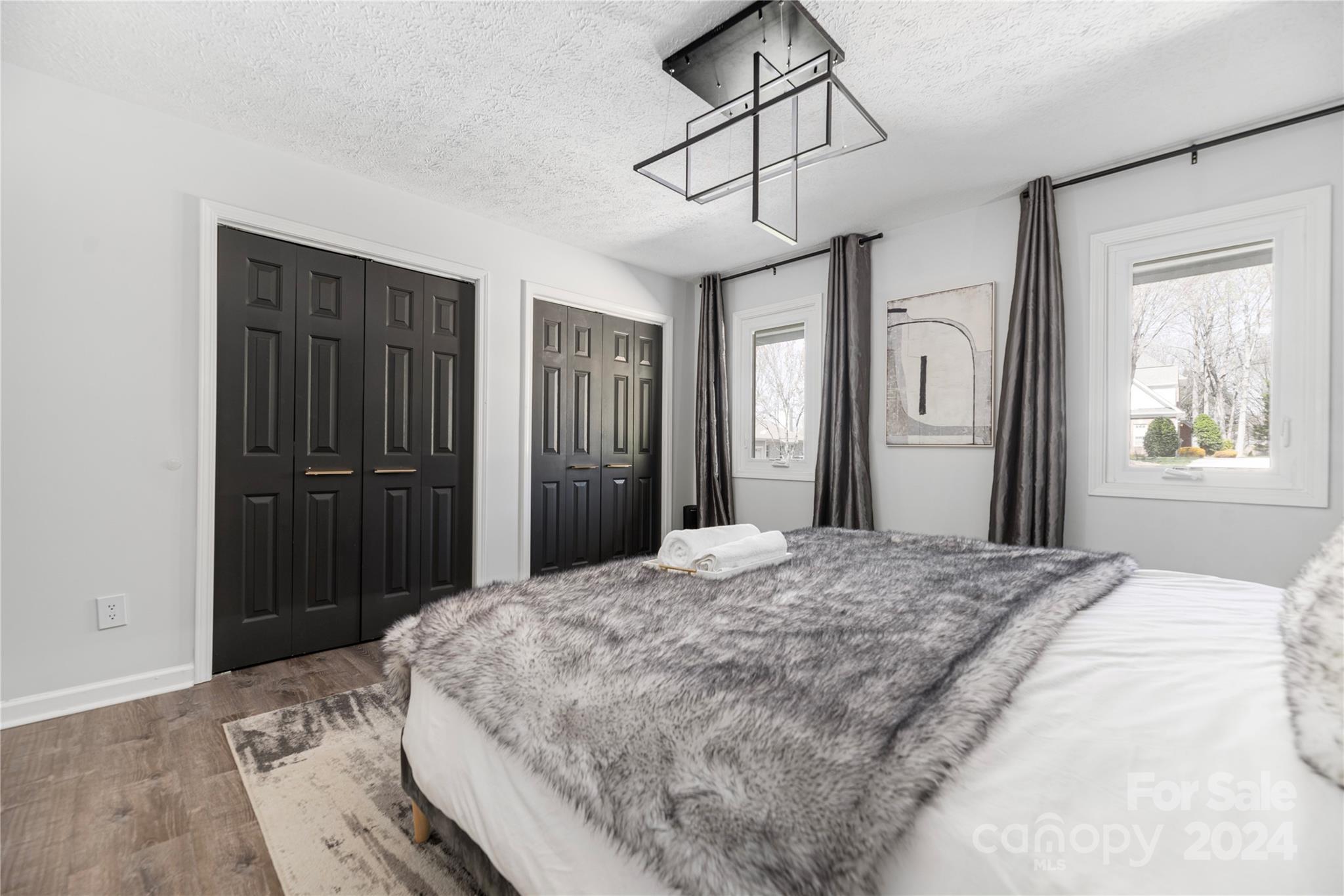 262 Spring Run Road Mooresville, NC 28117 - Photo 22 of 48 a bedroom with a bed and wooden floor