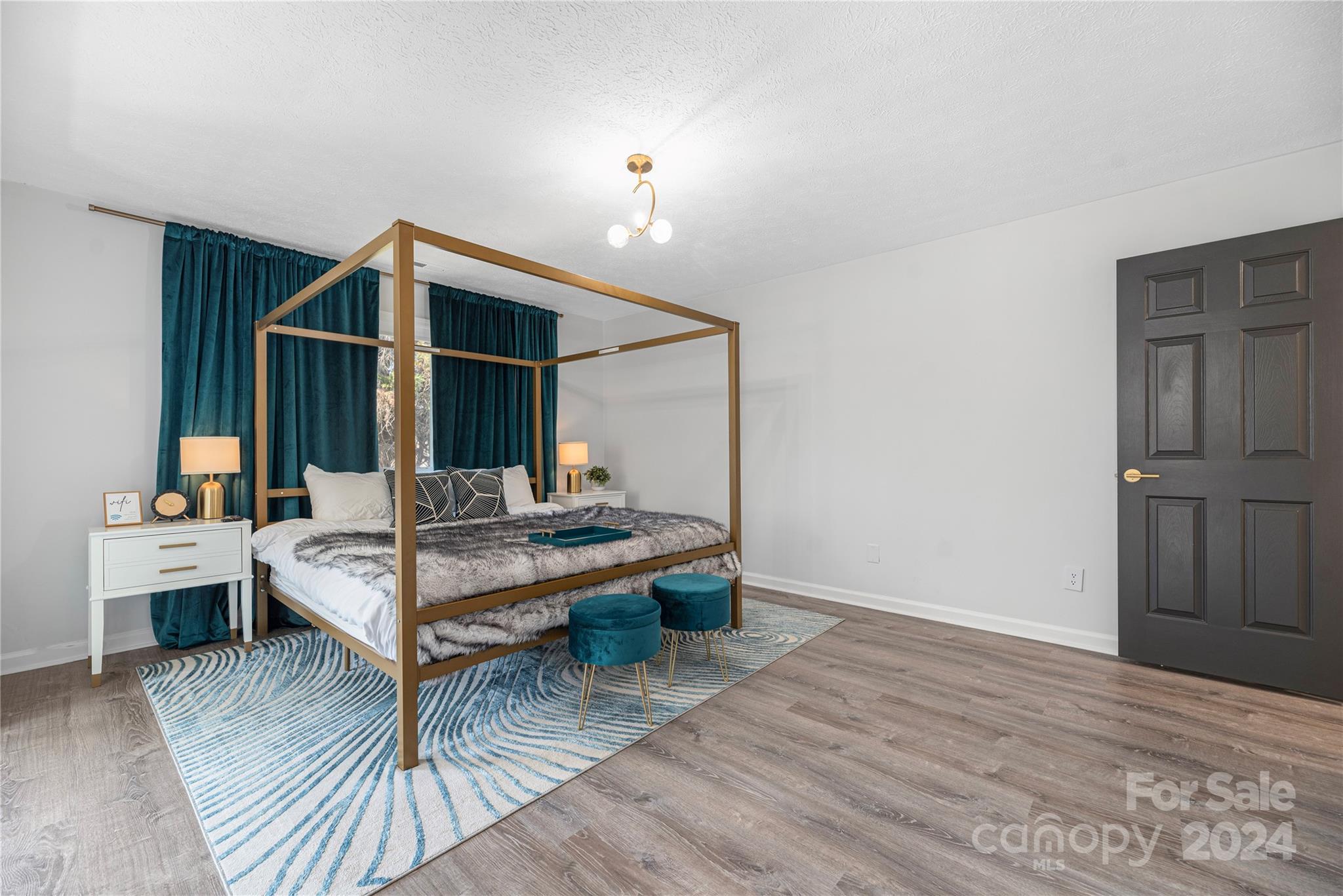 262 Spring Run Road Mooresville, NC 28117 - Photo 25 of 48 a living room with furniture and wooden floor