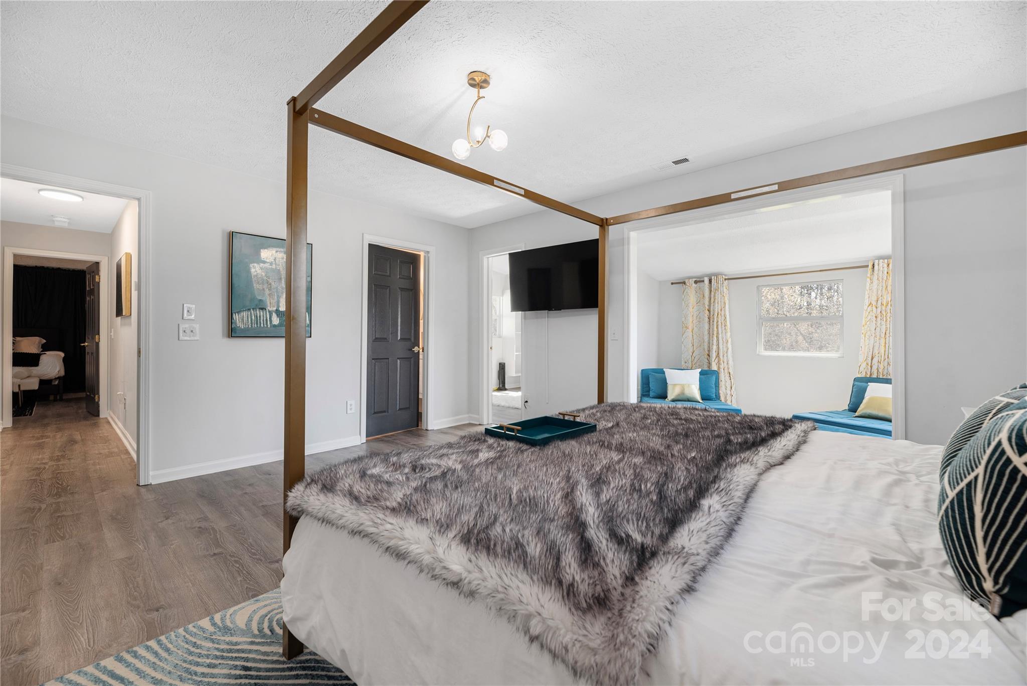 262 Spring Run Road Mooresville, NC 28117 - Photo 26 of 48 a bedroom with a large bed a flat tv screen and dresser