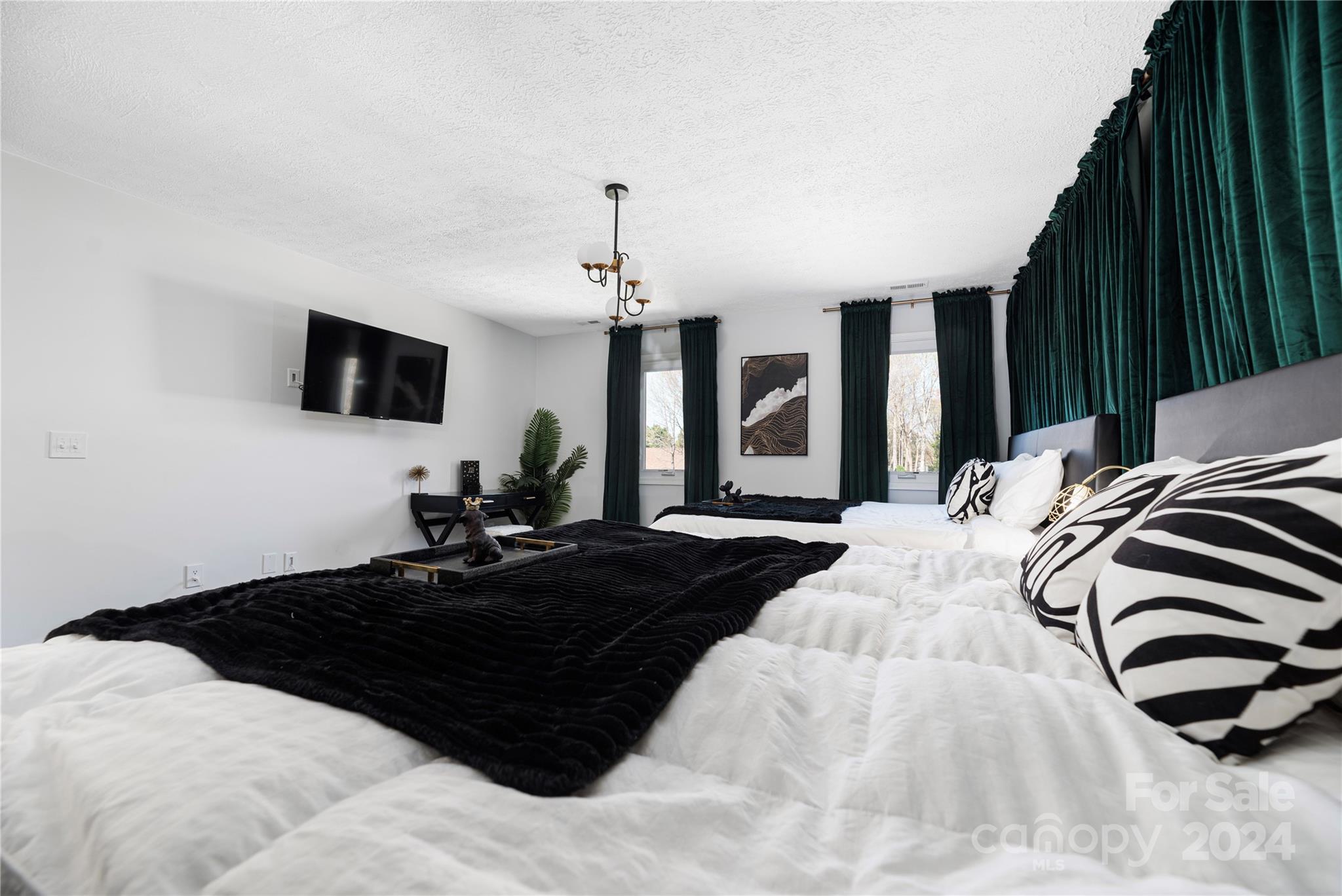 262 Spring Run Road Mooresville, NC 28117 - Photo 33 of 48 a bedroom with a bed window and a flat screen tv