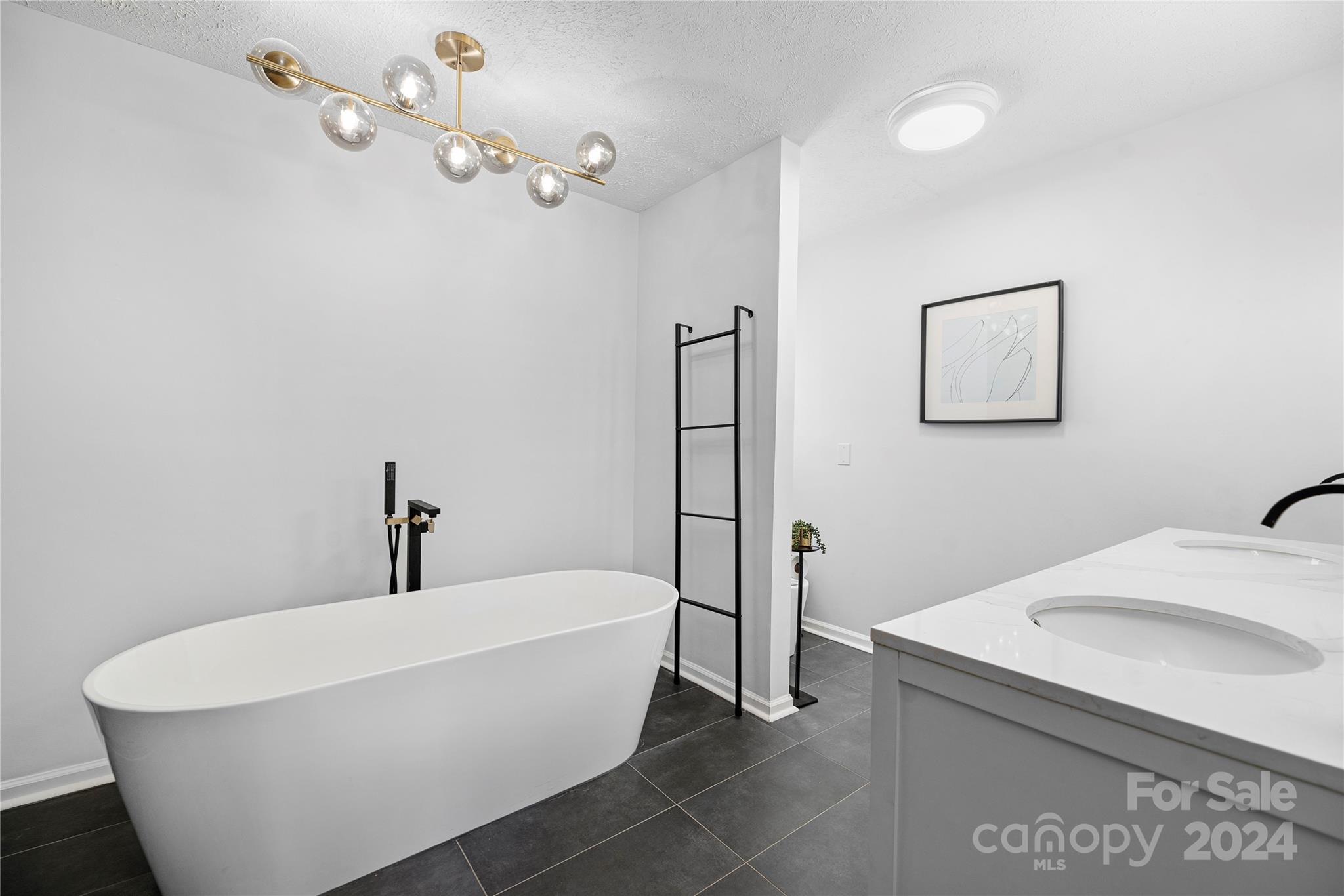 262 Spring Run Road Mooresville, NC 28117 - Photo 35 of 48 a white bath tub sitting in a bathroom