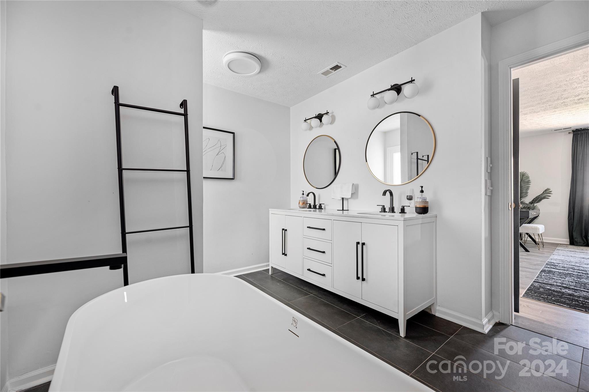 262 Spring Run Road Mooresville, NC 28117 - Photo 36 of 48 a bedroom with a bed and a dresser