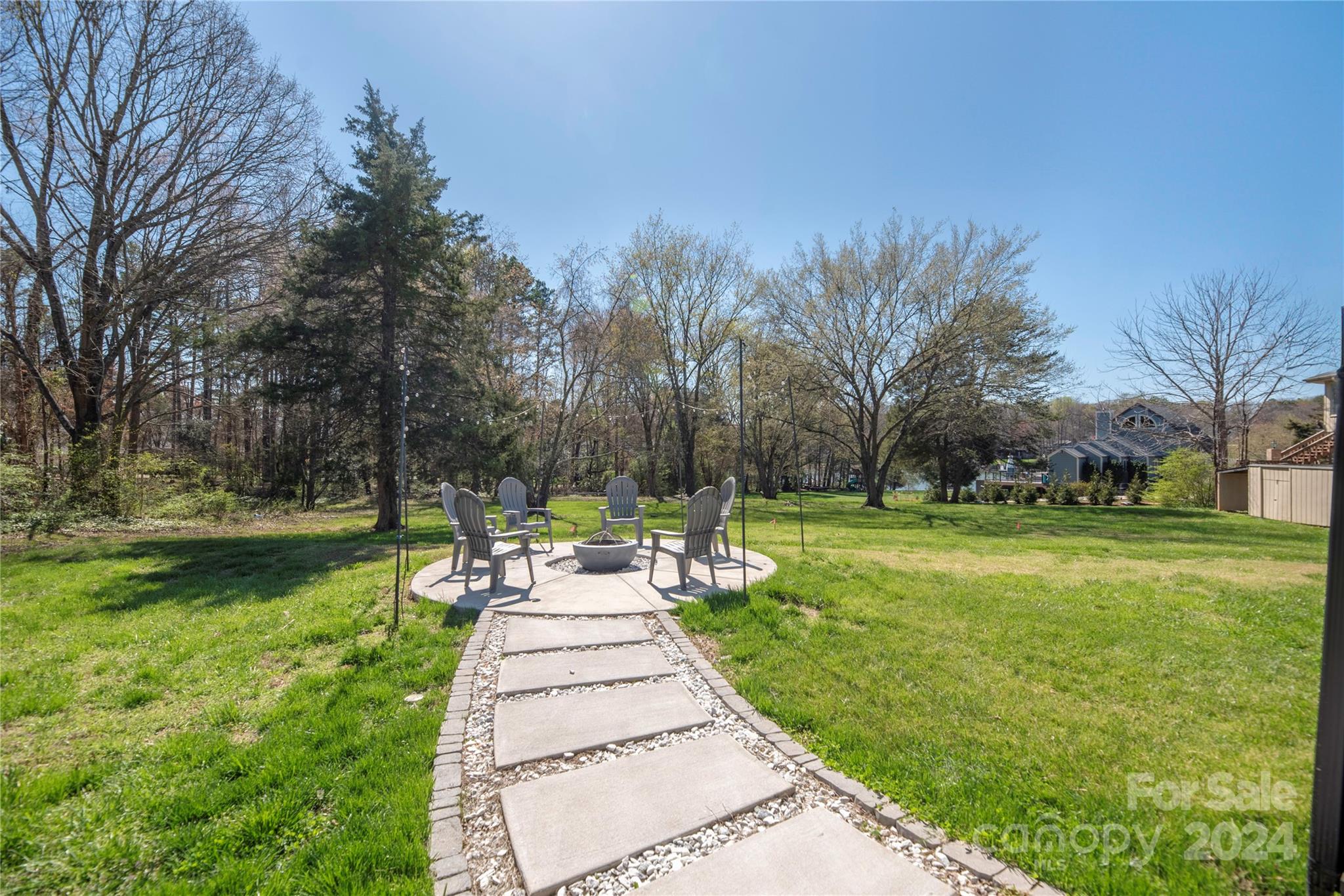 262 Spring Run Road Mooresville, NC 28117 - Photo 42 of 48 a front view of a garden with trees
