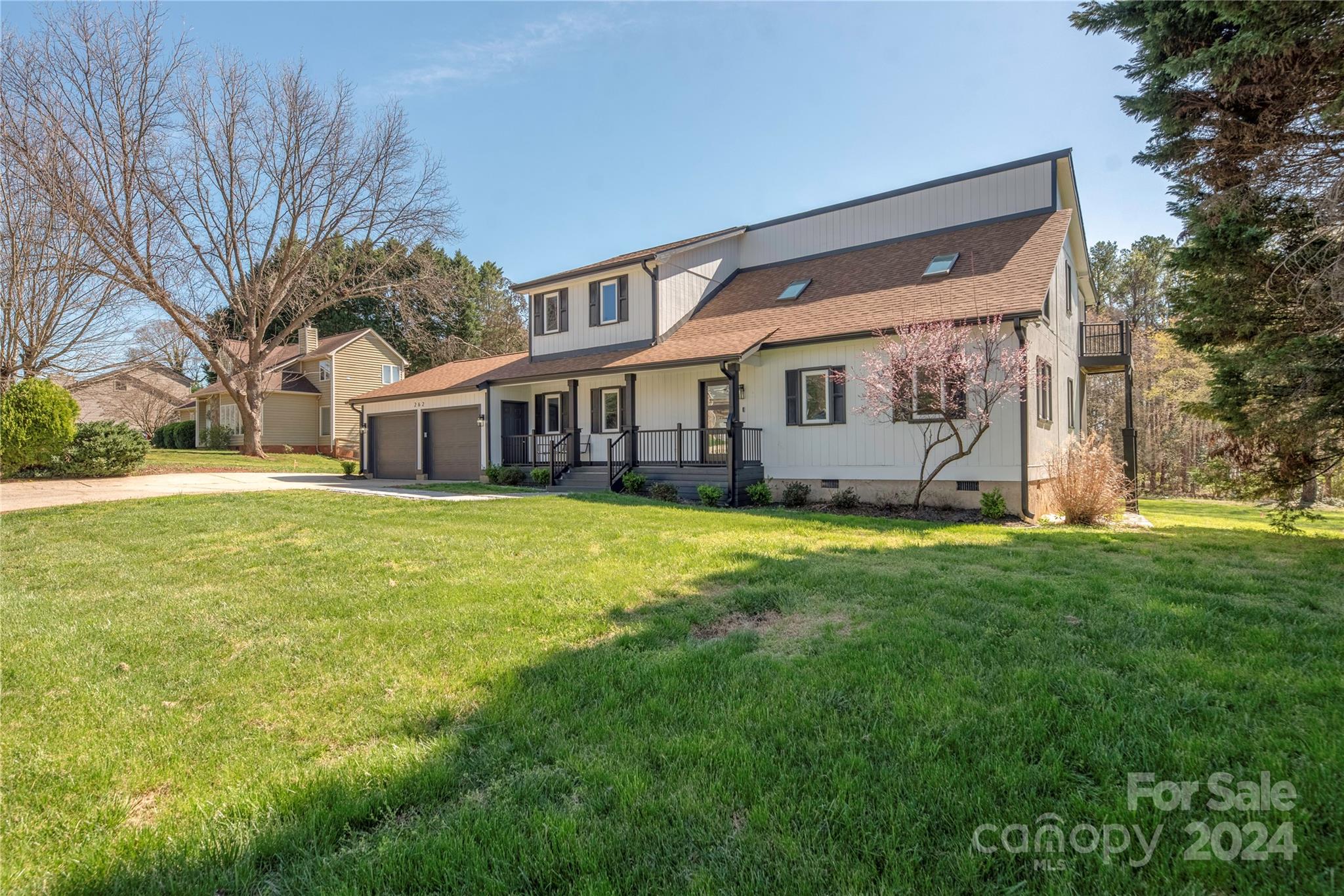262 Spring Run Road Mooresville, NC 28117 - Photo 5 of 48 a view of a house with a big yard and large trees